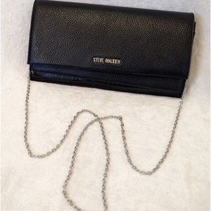 This is a steve madden clutch cross body bag